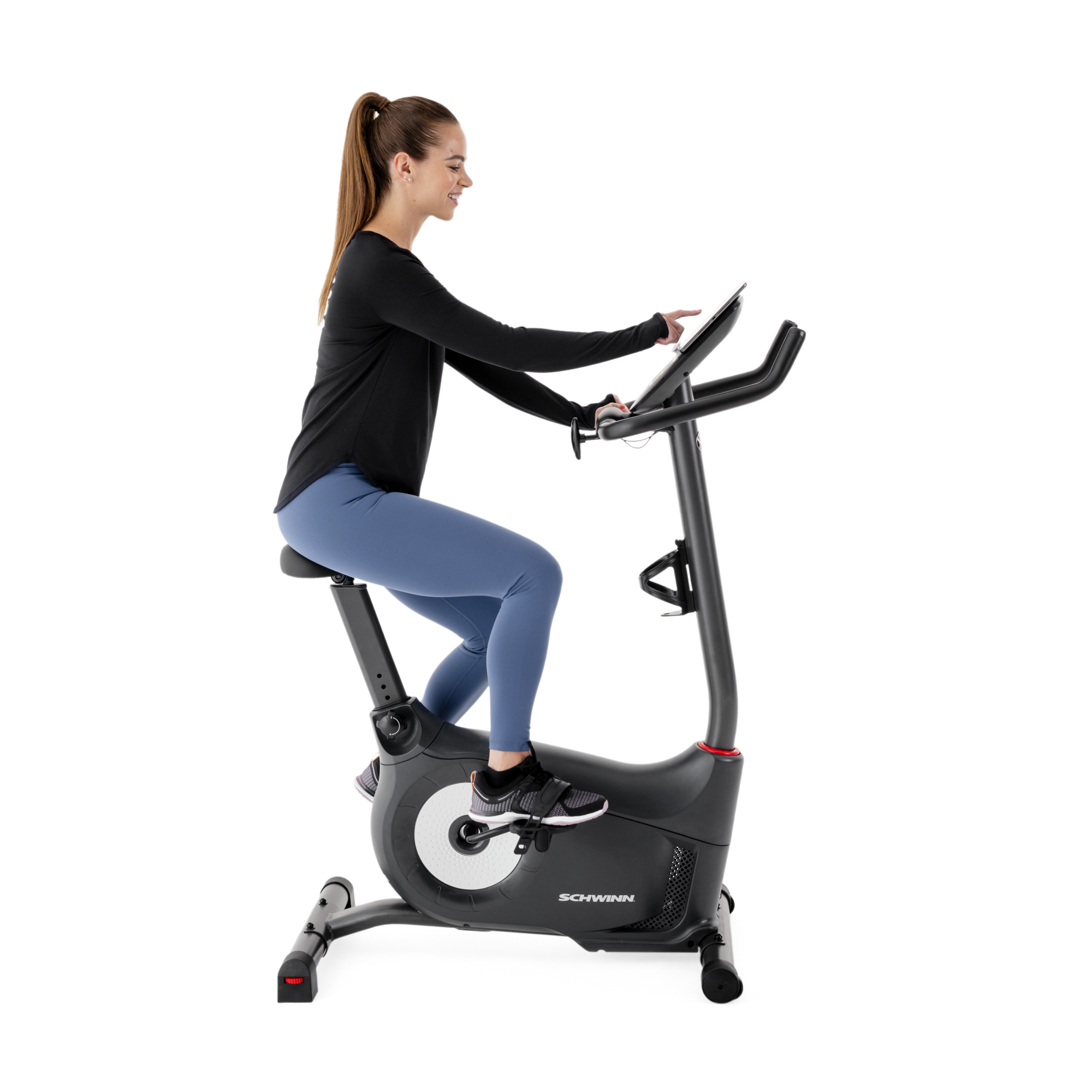 Side view of a woman using the Schwinn 510U Upright Bike.