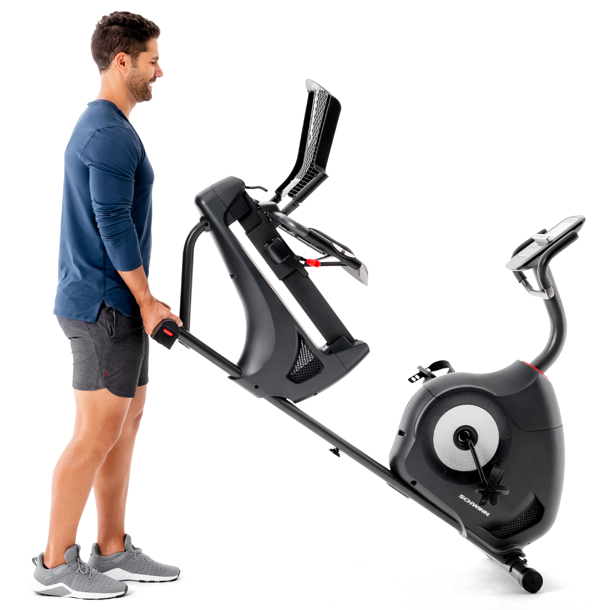 Man pushing the Schwinn 510R Recumbent Bike on its roller wheels.