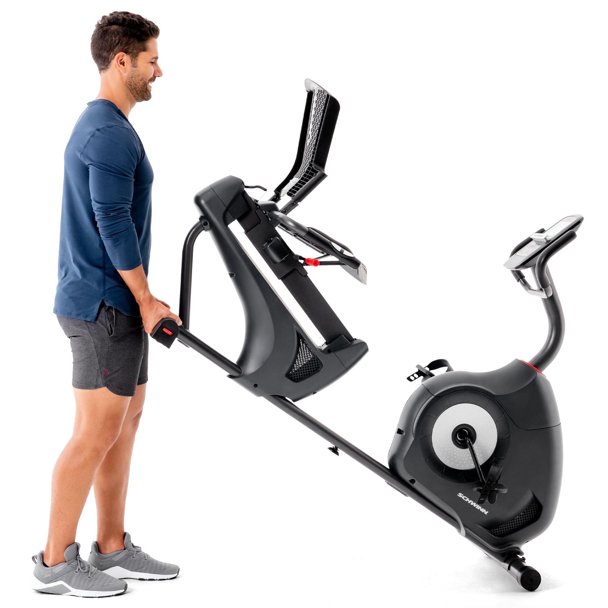 Man pushing the Schwinn 510R Recumbent Bike on its roller wheels.