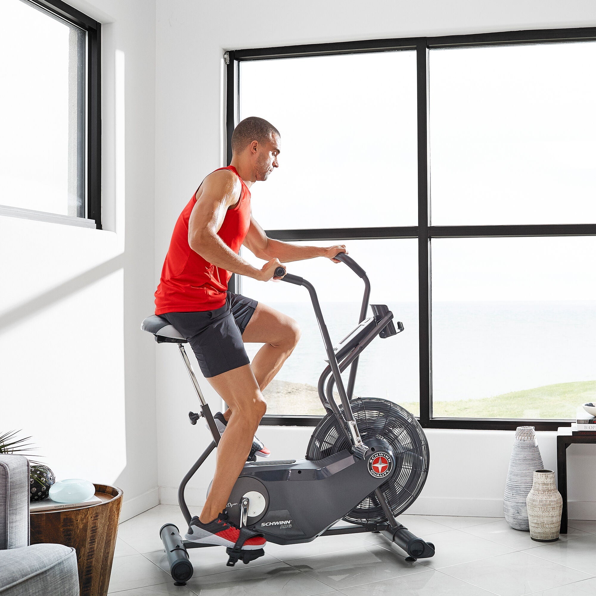 Man using the Schwinn Airdyne AD6i indoors.