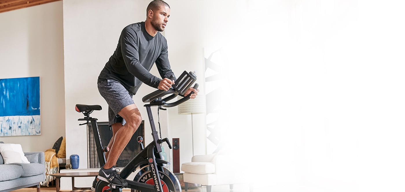 Young man exercising on a Schwinn IC Bike
