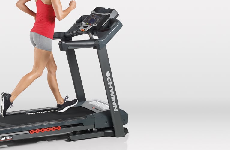 Woman running on a Schwinn treadmill